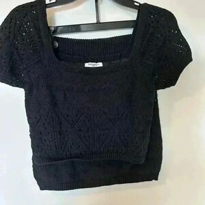 Brand freshman, two-piece black knitted, matching skirt and top.